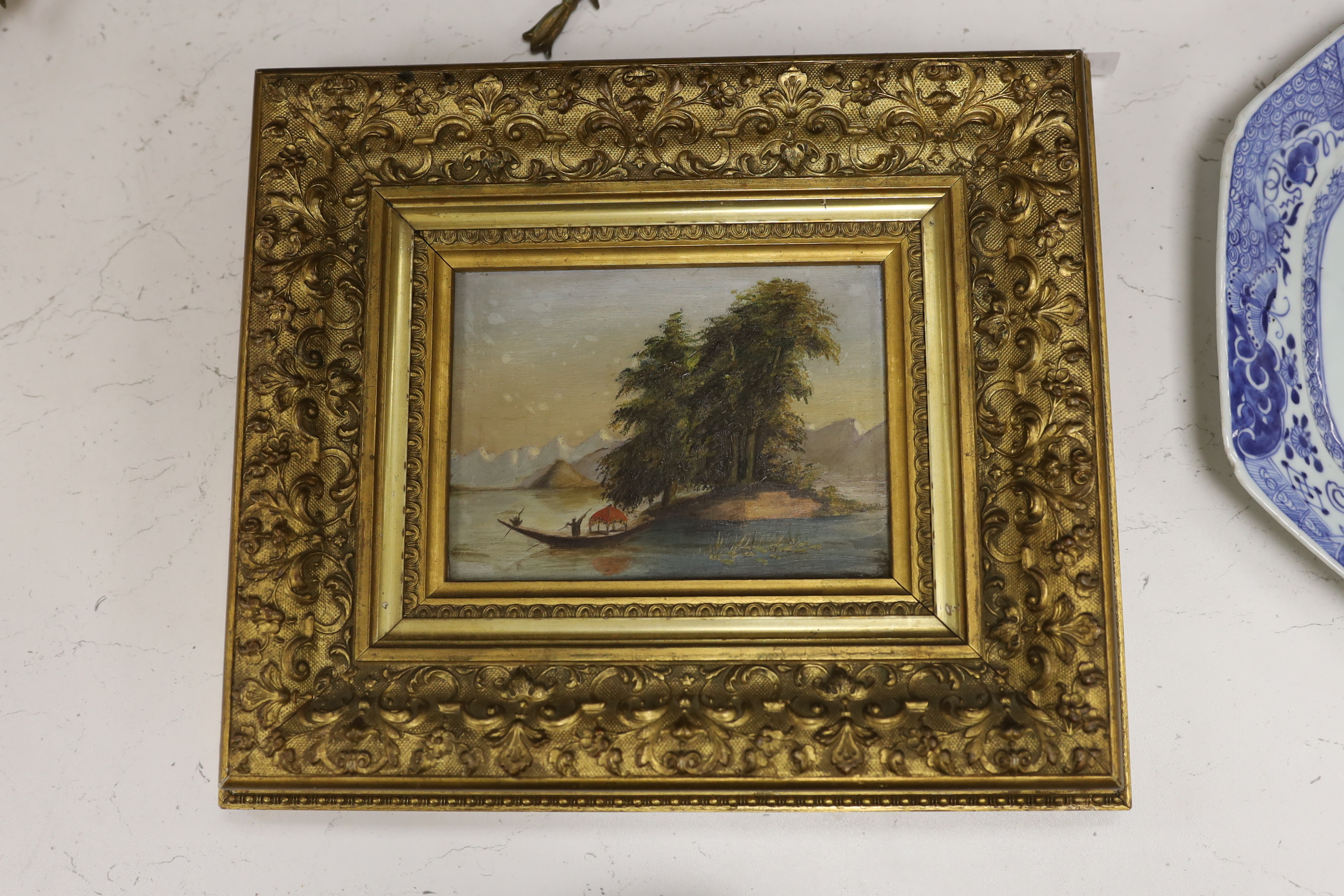 Eastern School, oil on board, Landscape with figure and boat, 12 x 17cm, ornate gilt frame